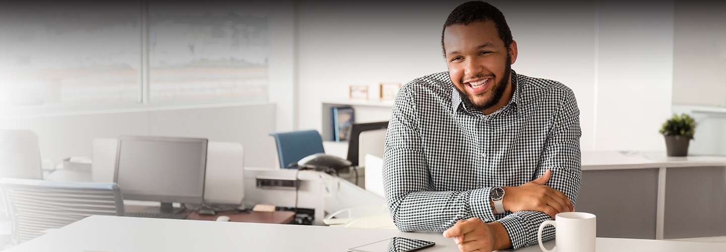 Happy, excited man using laptop